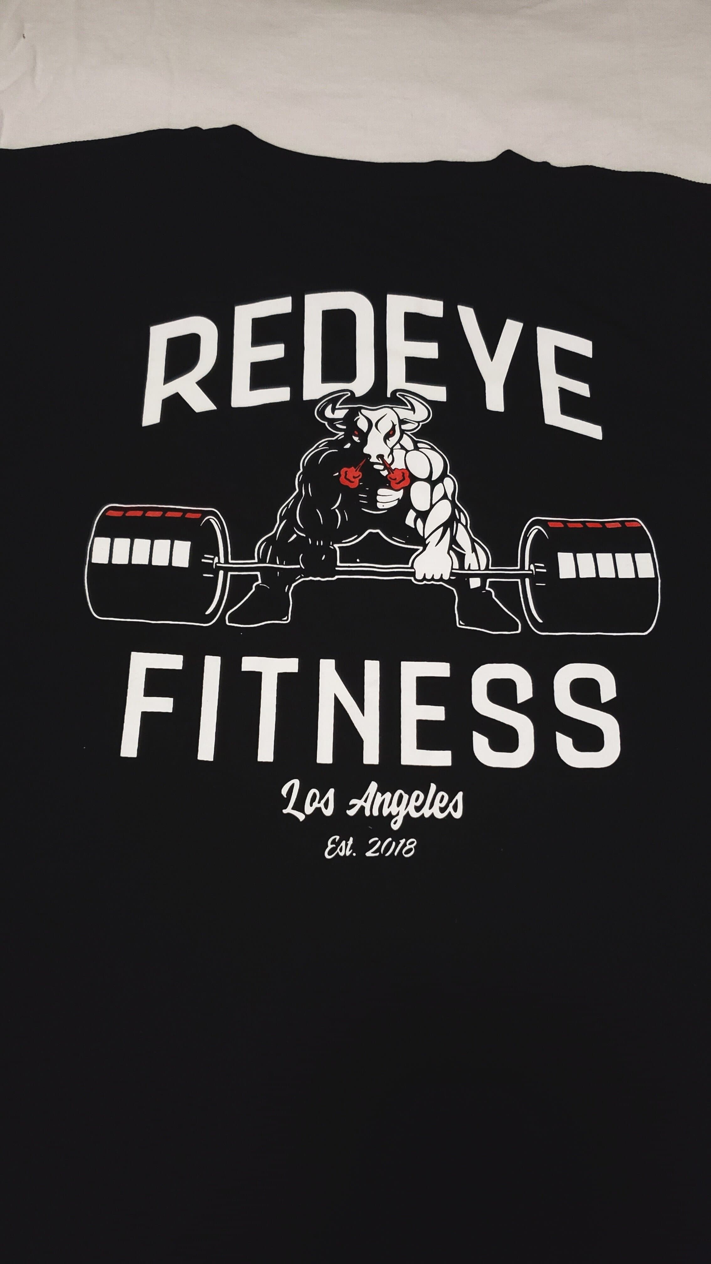 Black Gym T Shirt laid flat showing the back print: a fired up half man/half bull deadlifting a barbell, with REDEYE FITNESS and Los Angeles Est. 2018
